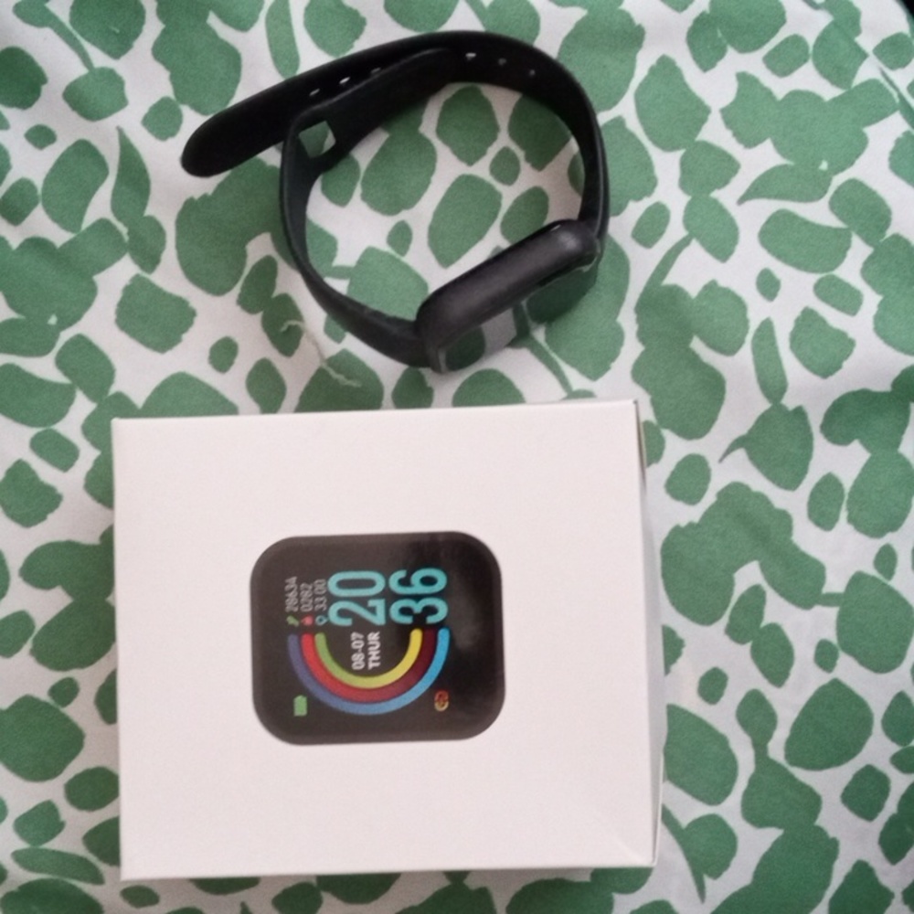 SMART WATCH band is black rubber nice NEW watch comes with box. Unisex